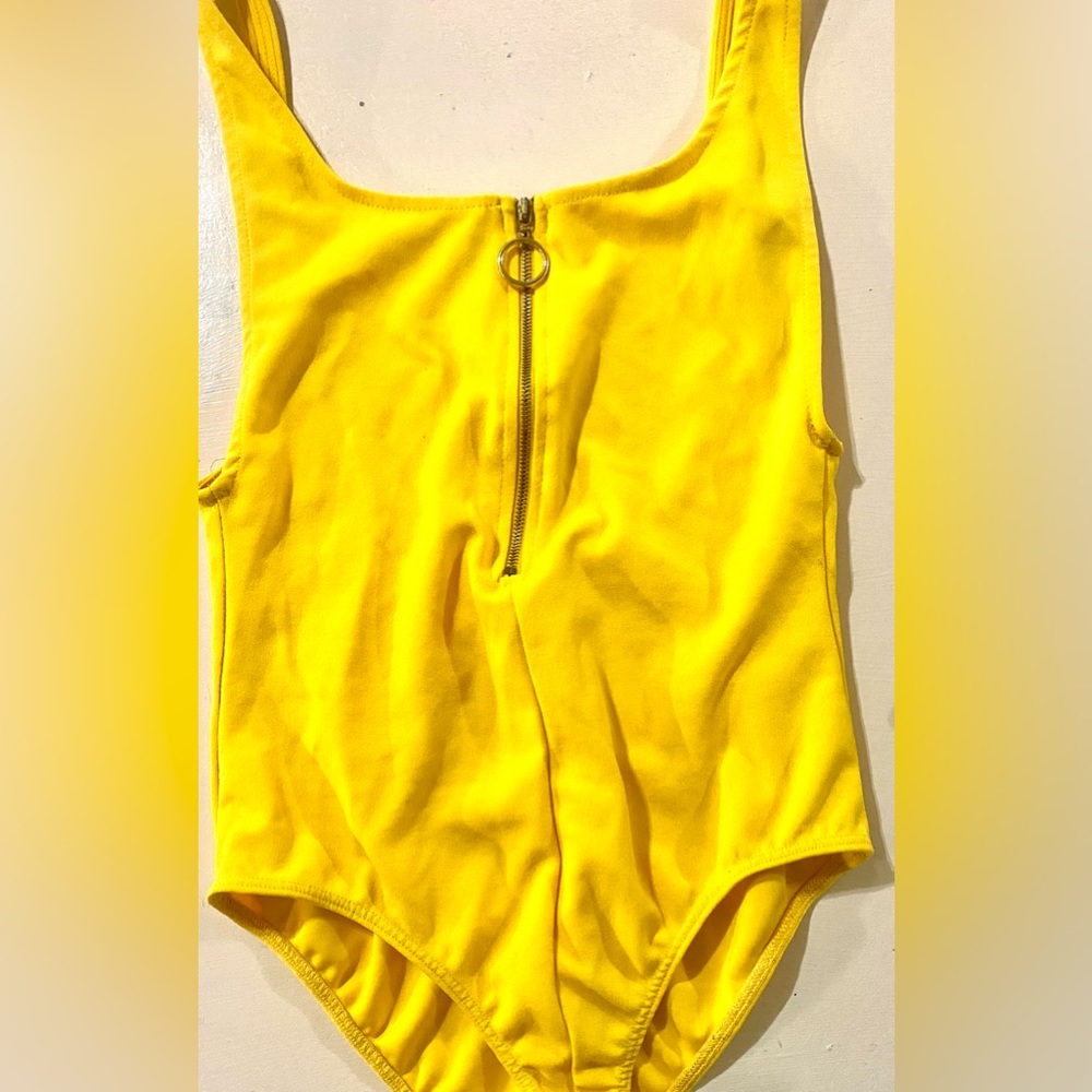 Size: Small. Brand: Charlotte Rouse Bodysuit with an open back. Color: Yellow